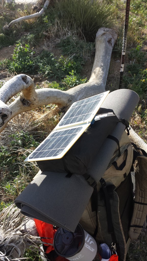 My solar charger, velcroed to the top of my pack